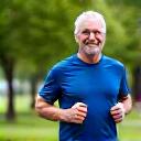 Active man in his early 50s, David, running outdoors