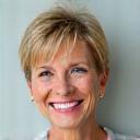 Smiling woman in her late 40s, Sarah, looking vibrant