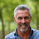 Portrait of David K., 48, smiling confidently